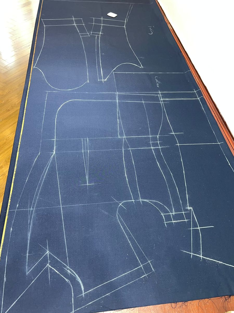 Pattern chalked onto cloth before cutting